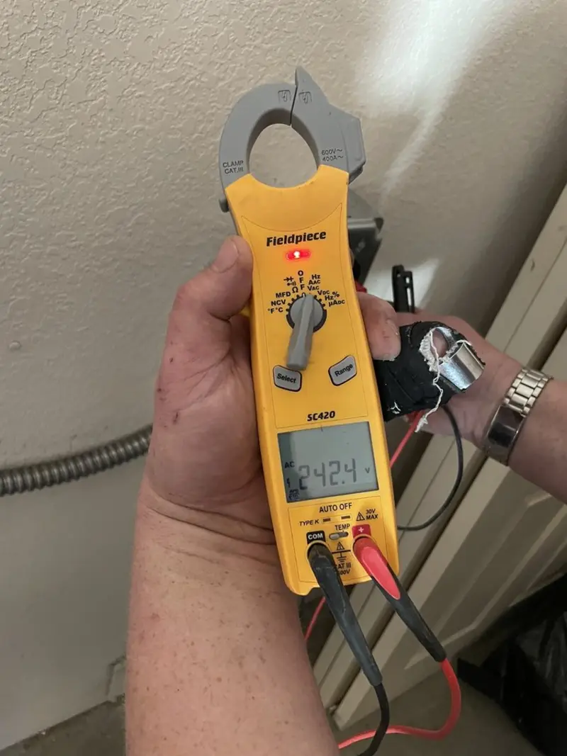 Voltage testing with clamp meter during Generator Installation in Sarasota Springs
